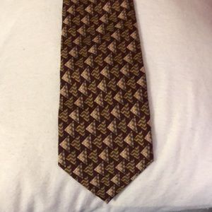 Brand unknown. Tie in great shape no tears or stains . 100%silk made in Korea.